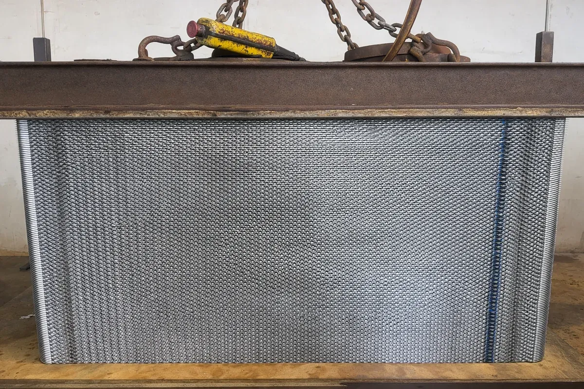 Plate pack with new gaskets curing under weight